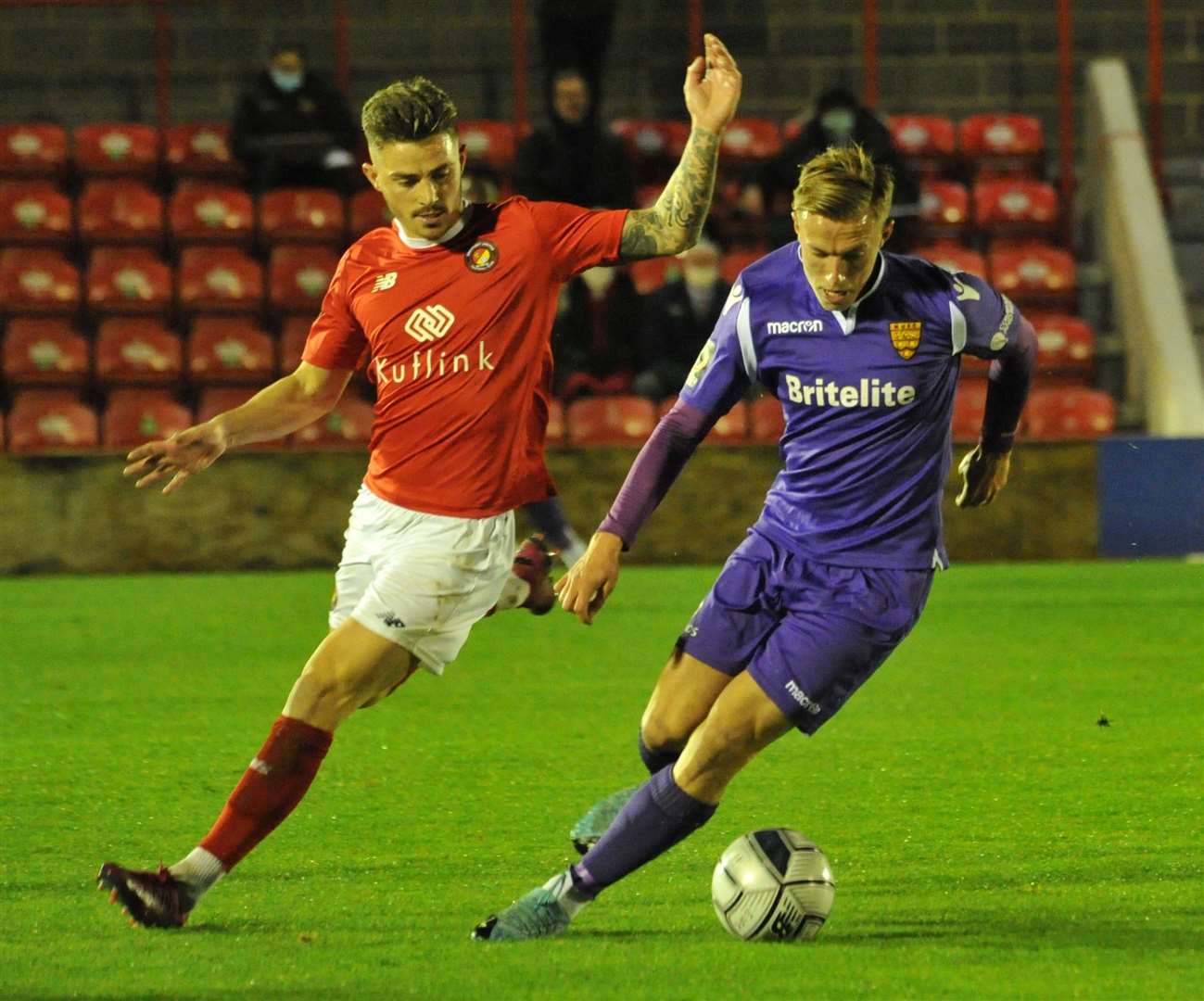 Sam Corne does battle with ex-Maidstone favourite Jack Paxman Picture: Steve Terrell