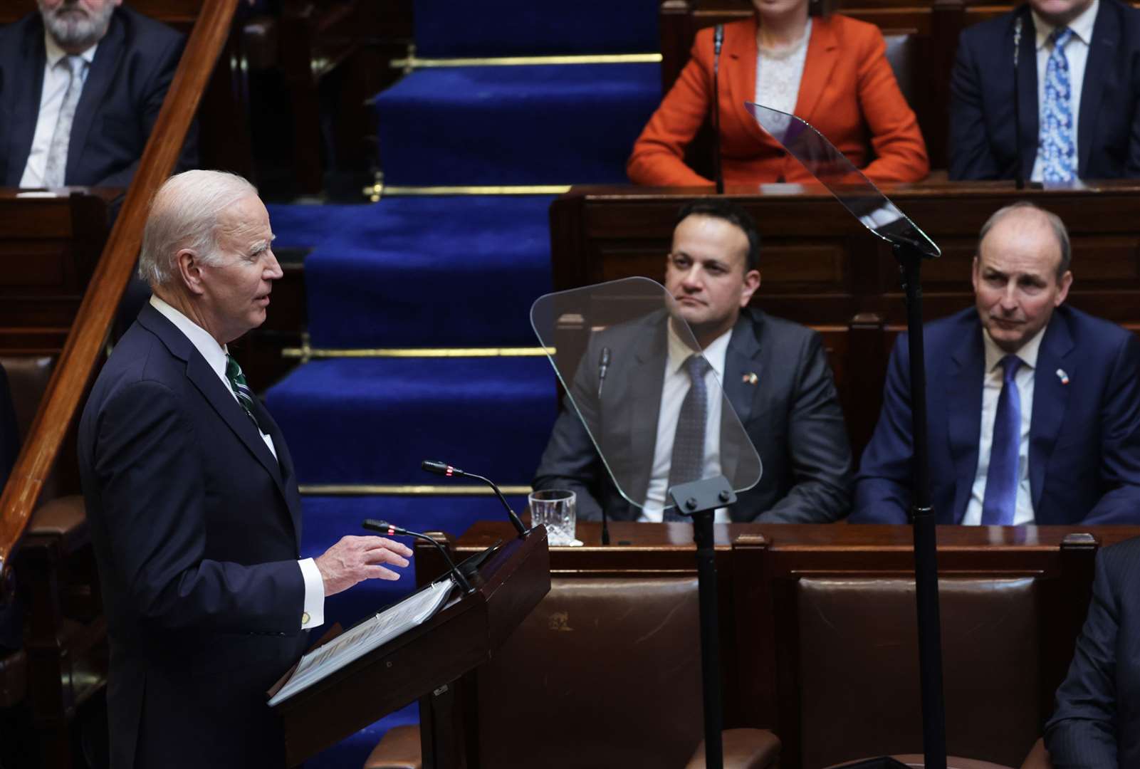 US President Joe Biden addressing the Oireachtas as Leo Varadkar and deputy premier Micheal Martin watch on (Government of Ireland/PA)