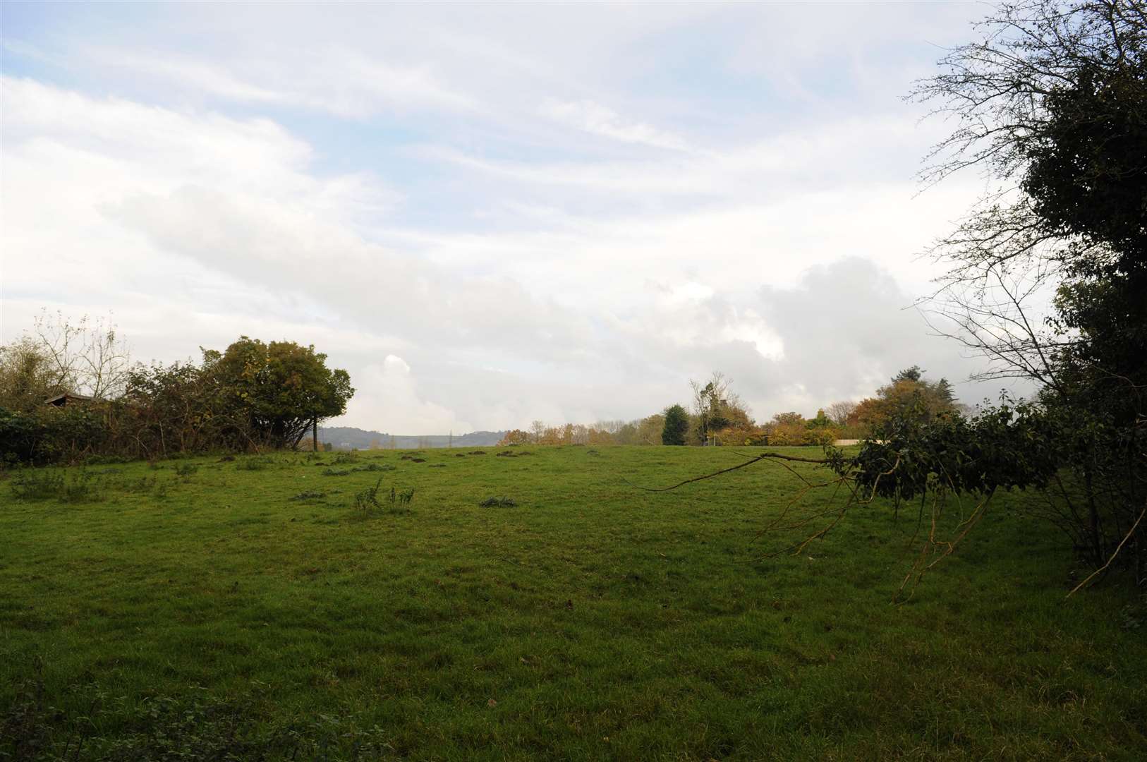 The area for development at Barty Farm. A large expanse of open land bordered by Roundwell, Water Lane and the railway line