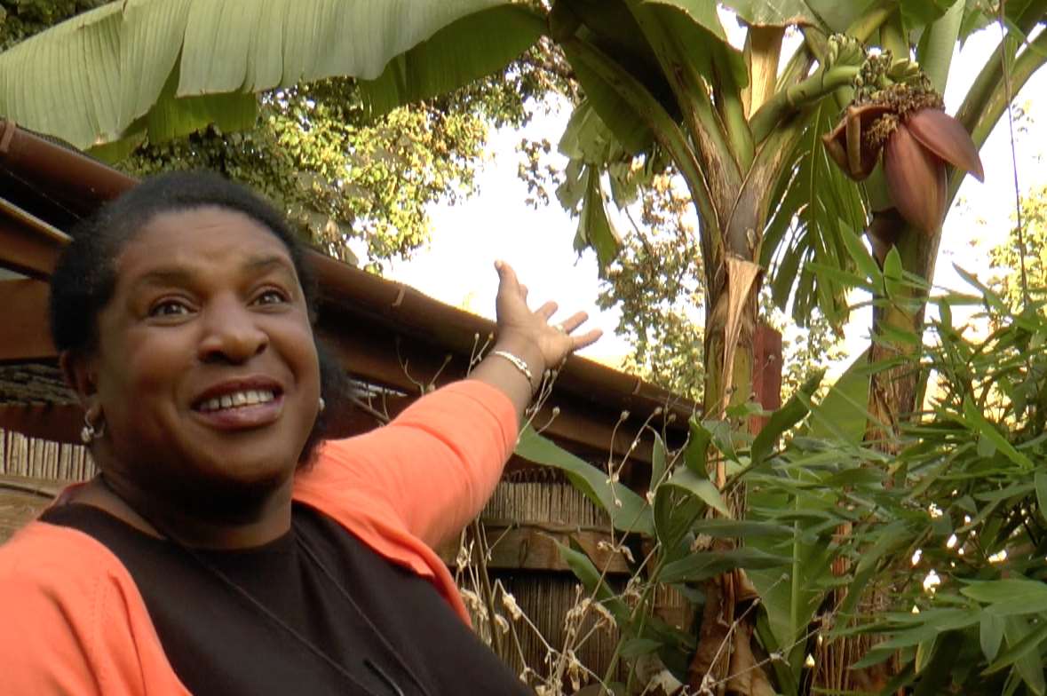 Sharon Richards with her fruiting banana tree