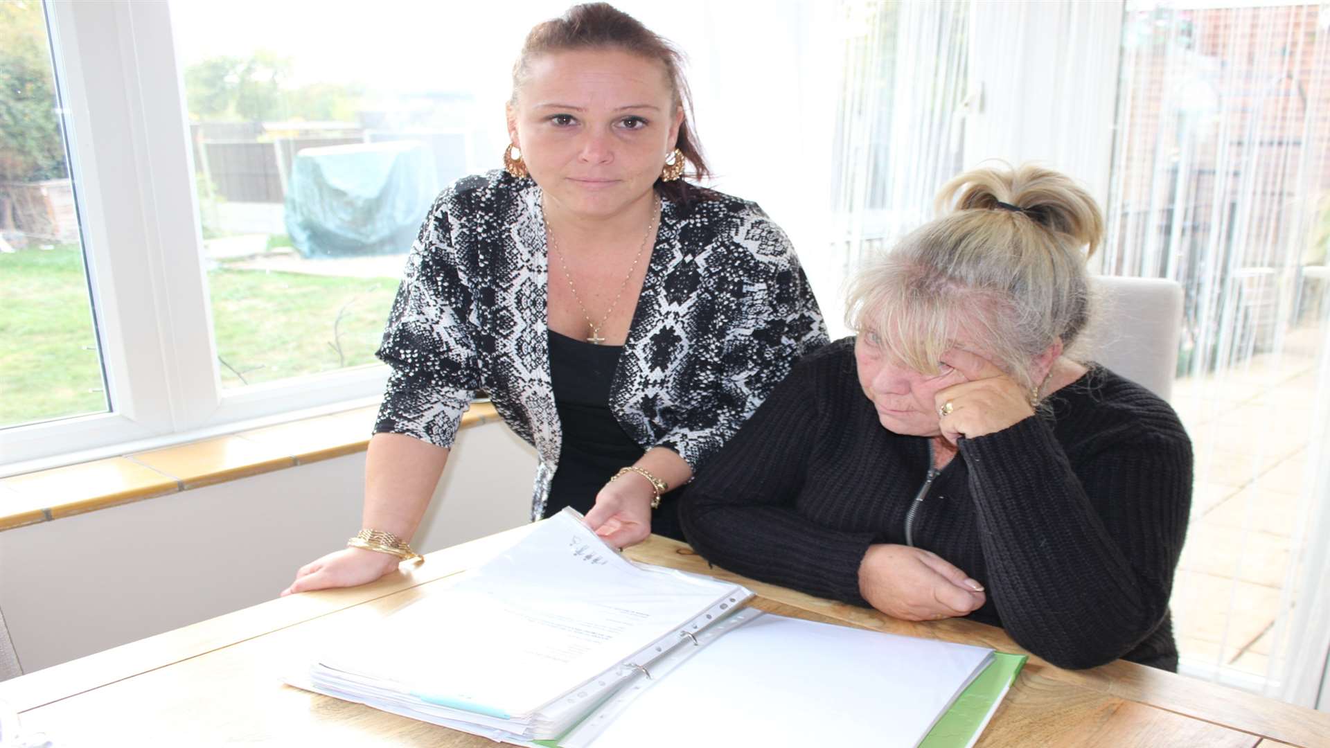 Pauline and Tammy Brooks of Highfield Road, halfway, Minster, Sheppey, study their file of correspondence following the death of Ray Brooks