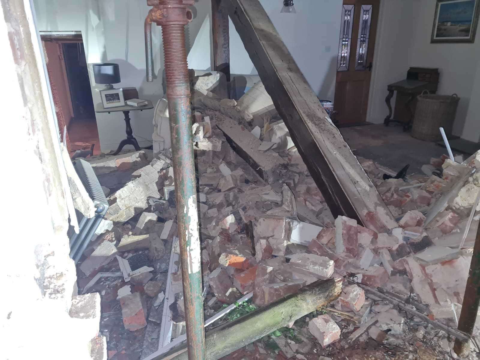 Debris in the living room of the home near Mersham