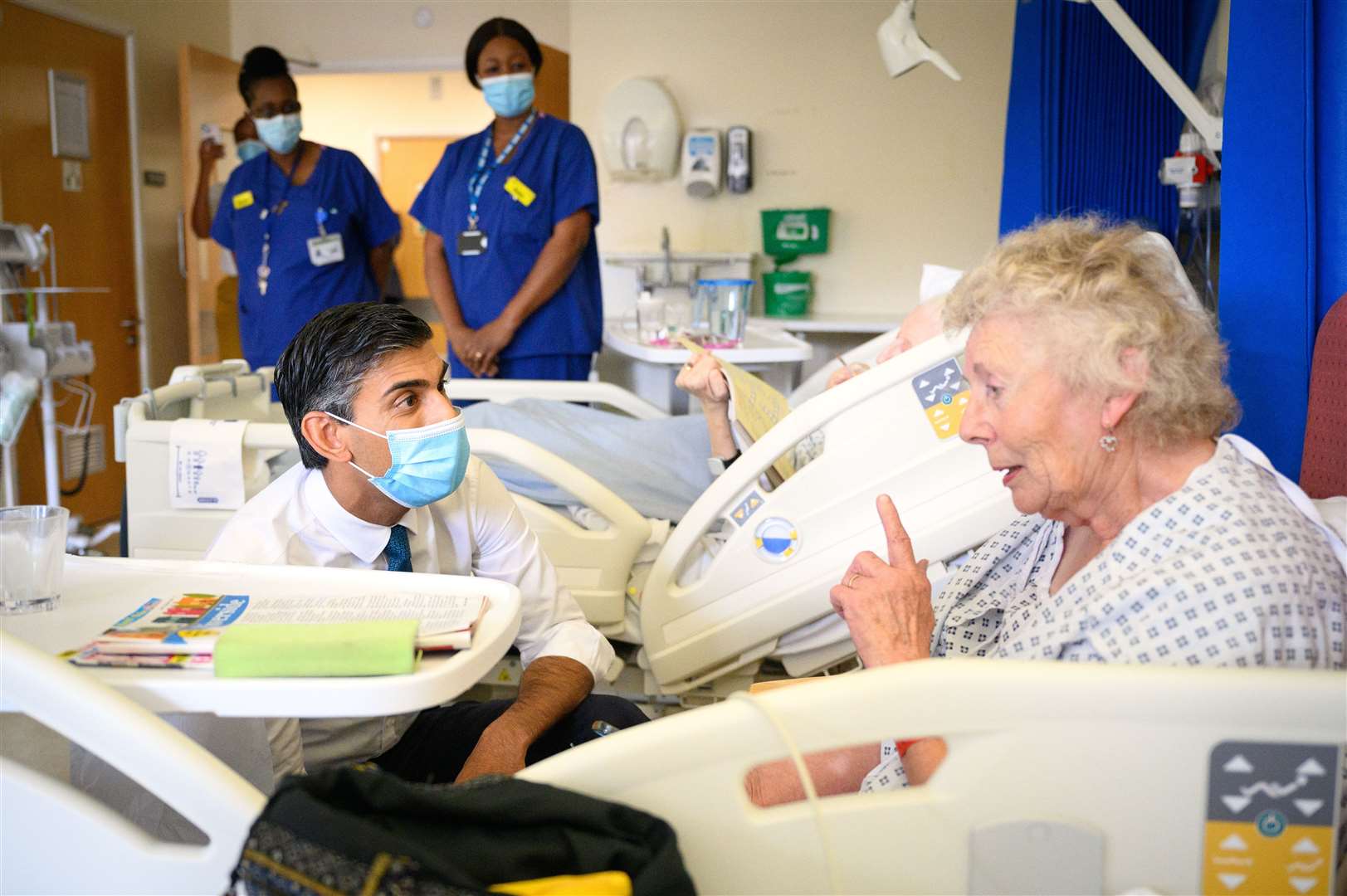 Prime Minister Rishi Sunak speaks with patient Catherine Poole during a visit to Croydon University Hospital last year (PA)