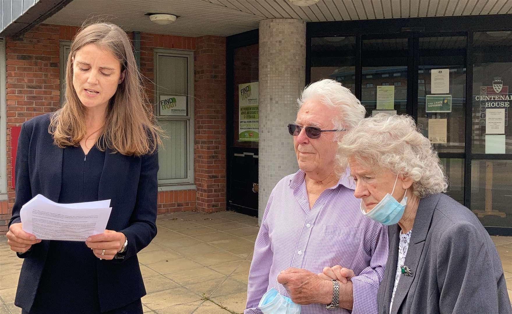 Alice Hardy, of Hodge Jones & Allen Solicitors, reads a statement on behalf of Susan Nicholson’s parents Peter and Elizabeth Skelton while standing next to them outside the inquest in Crawley (Michael Drummond/PA)