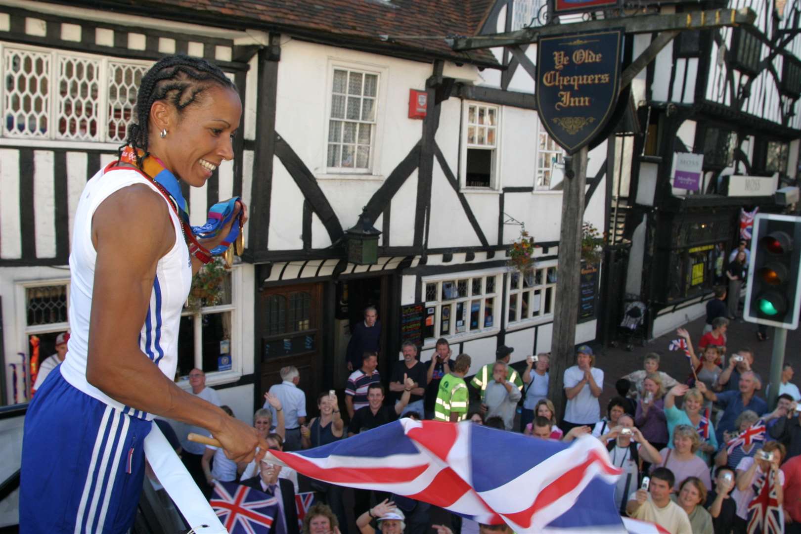 Kelly Holmes passes the pub during her victory parade in 2004 after winning two gold medals at the Olympics. Picture: Matthew Walker