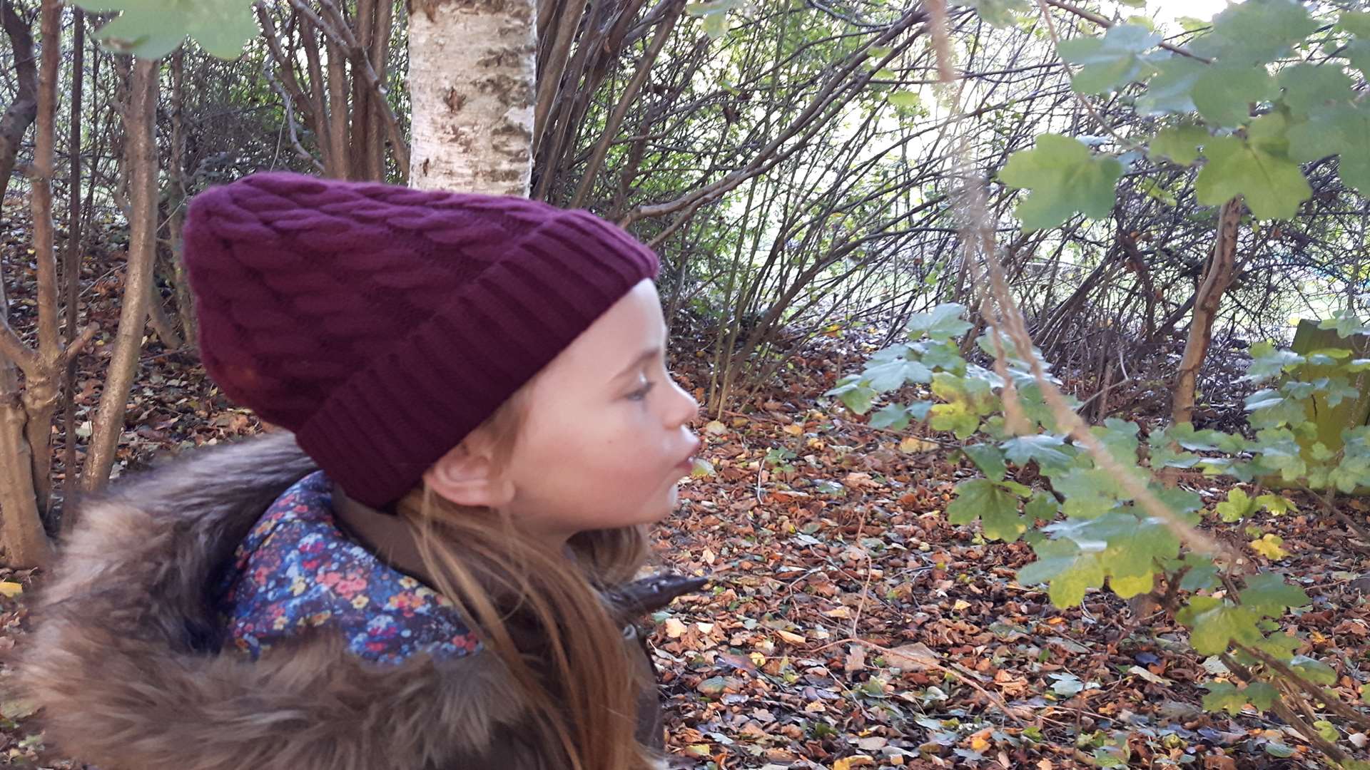 Eva-Mae Lee Davrey blowing on a leaf in the Green Zone as part of an experiment