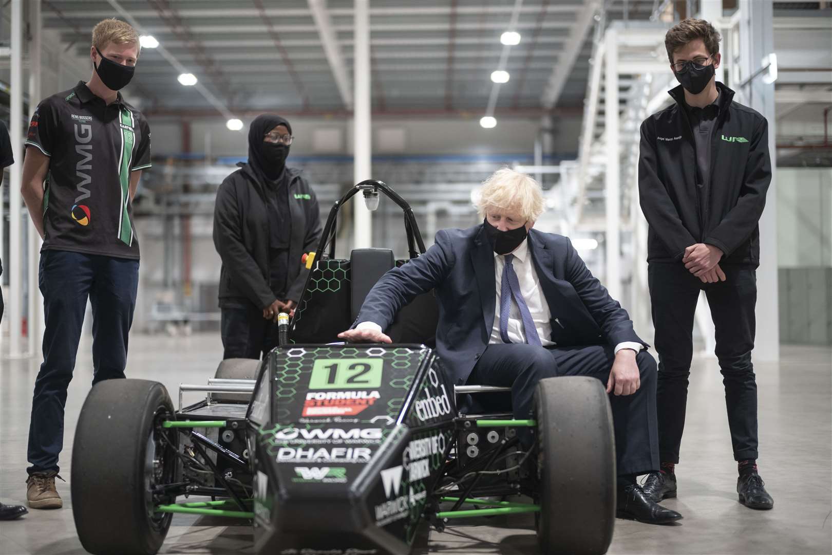 Boris Johnson with an electric car during his visit to the UK Battery Industrialisation Centre in Coventry (Daily Telegraph/David Rose/PA)