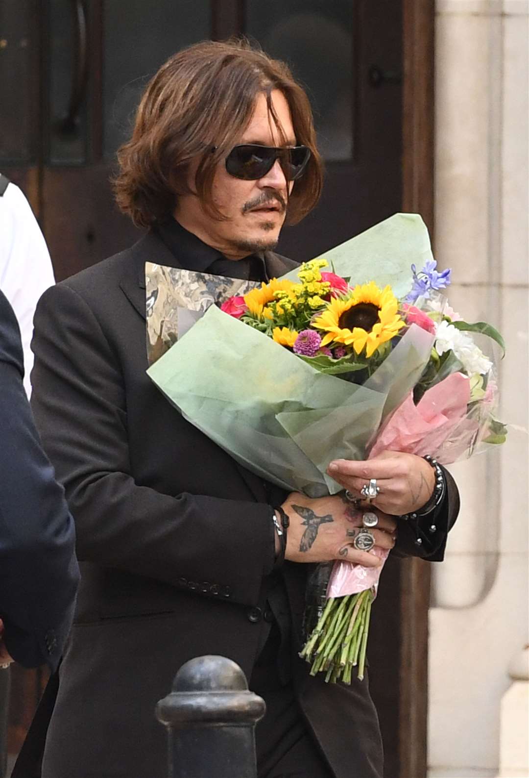 Actor Johnny Depp leaving the High Court in London (Kirsty O’Connor/PA)