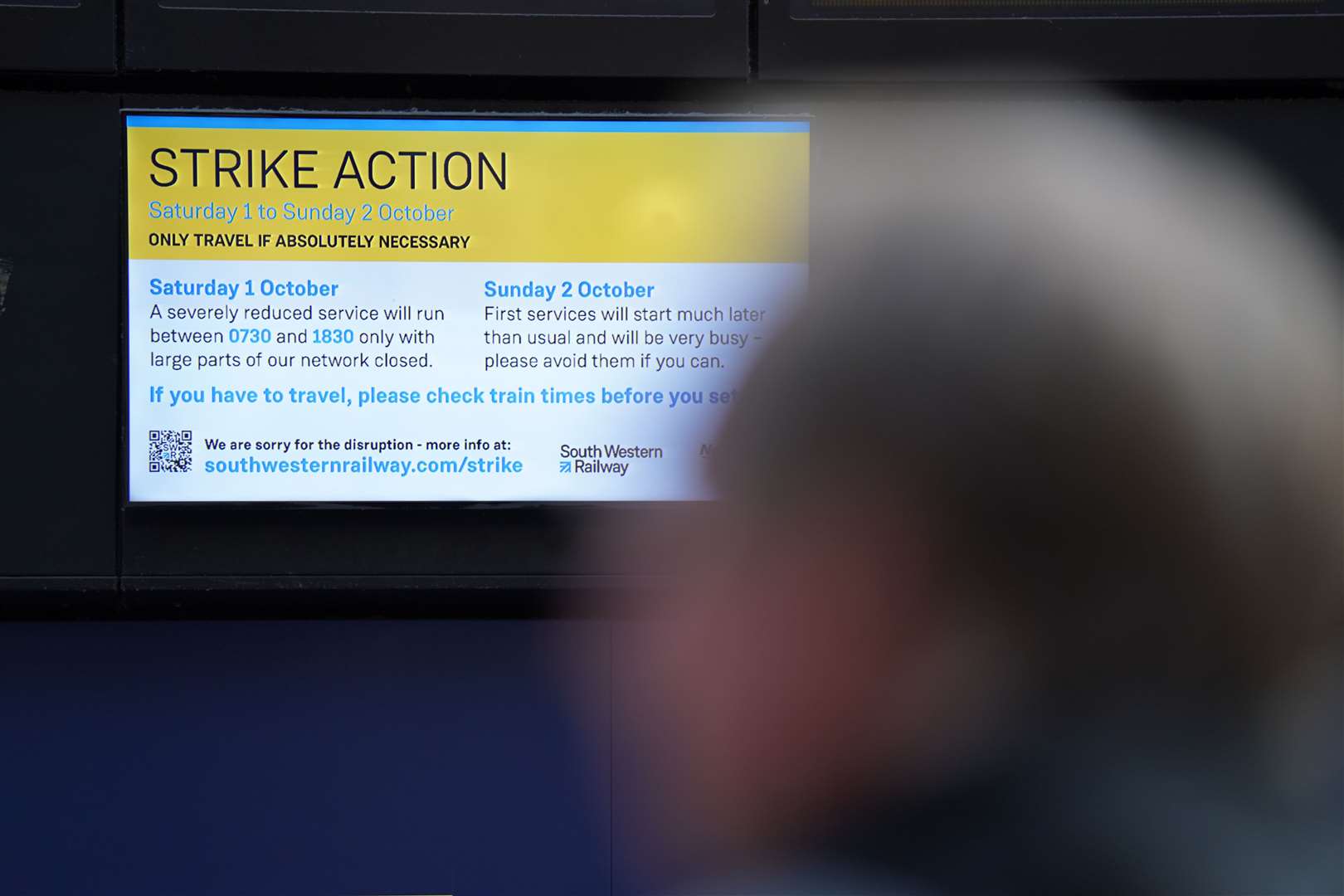 A sign warning passengers at Waterloo Station in London, of planned strikes (PA)