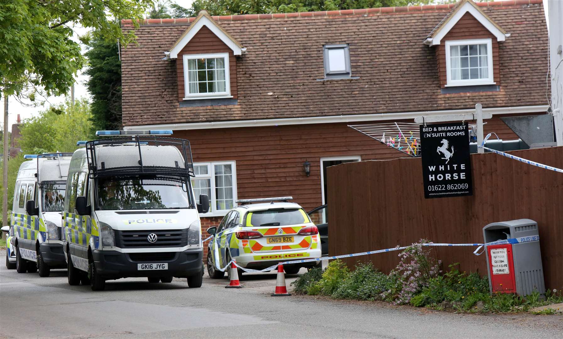 Police outside the White Horse in Otham after the brawl Picture: UKNIP