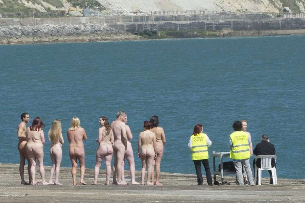 Cheeky models line up naked on The Warren beach in Folkestone for  world-renowned artist Spencer Tunick for project called Scope Out