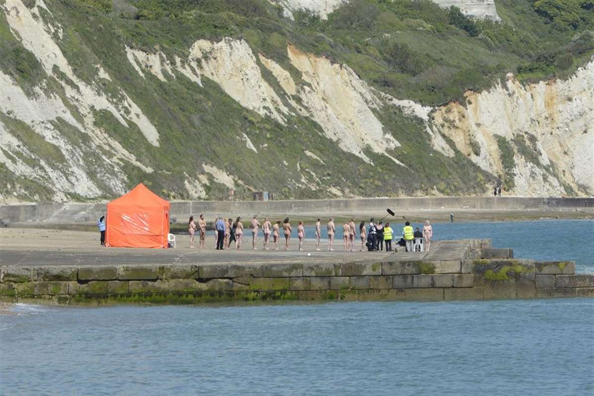 Cheeky models line up naked on The Warren beach in Folkestone for  world-renowned artist Spencer Tunick for project called Scope Out