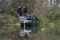 Police divers remove large black bag from river during hunt for Gaynor Lord