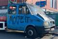 Vigilante sprays 'move it' on abandoned vans