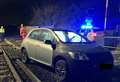 Car crashes through level crossing