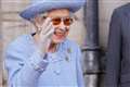 Smiling Queen takes part in third event during royal week in Scotland