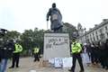 Churchill’s grandson condemns ‘disgusting’ defacing of Parliament Square statue