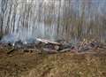 Fire crews tackling woodland blaze near motorway