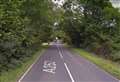 Road blocked by fallen branches 