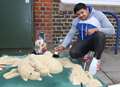 Sand man creates dog in town centre