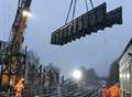 Footbridge lowered into place during snowstorm