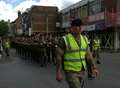 Soldiers march through town