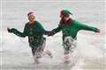 In Pictures: Swimmers take a dip and shoppers eye sales on Boxing Day