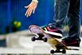 Reporter delivers news live while riding a skateboard