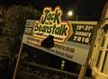 Yobs punch hole in panto sign