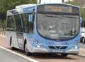 Bus and car crash on busy road