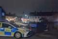 Police place cordon near convenience store in residential street