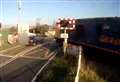 Car narrowly avoids being hit by train