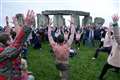 Thousands greet dawn with cheers at Stonehenge to mark winter solstice