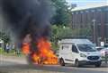 Vehicle erupts into fireball on busy road