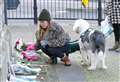 Flowers and handwritten notes laid at clocktower in memory of Liam Payne