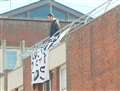 Rooftop drama as man threatens