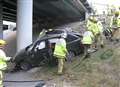 Woman hurt as car comes off M2