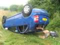 Man hurt when car overturns