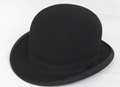 Thug steals victim's bowler hat in assault