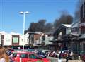 Palls of smoke at shopping centre