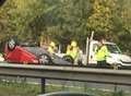 Pensioner trapped after car flips on roof in crash