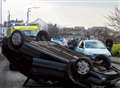 Car flips over in town centre