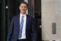 Hunt says he wants to ‘lighten the tax burden’ but plays downs expectations