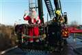 High-rise Santa lifts spirits at children’s hospital