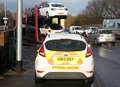 Car transporter hits railway bridge