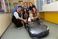 Kids race Tesla through hospital