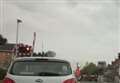 Car collides with level crossing barriers