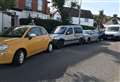 Van smashes into parked cars