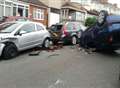 Car wedged upside down blocks street