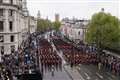 Horse rears backwards into crowds during coronation procession